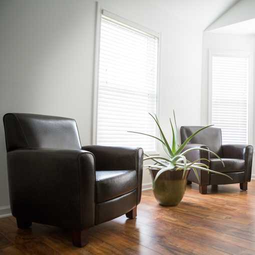 Leather chairs on hardwood floors