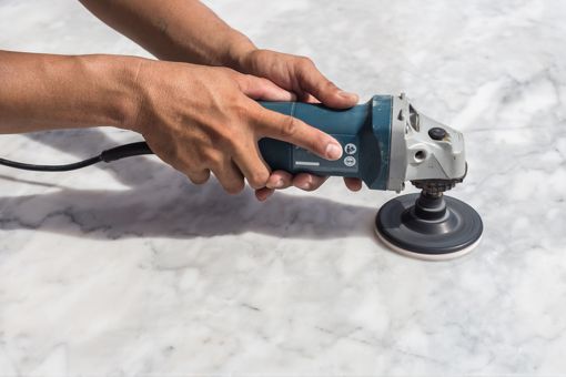 Polishing Marble counter top.