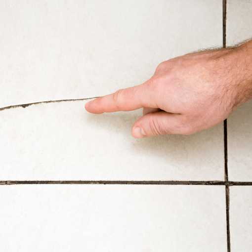 Man Inspecting a tile